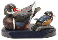Wood Ducks with Spreaded Wings on a Base